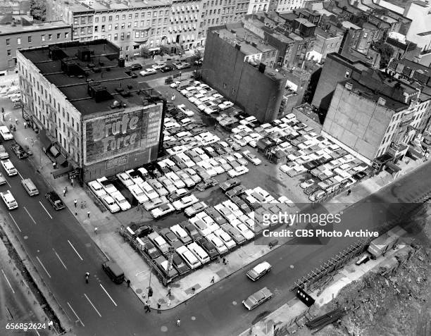 Parking lot and low rise buildings, the future site of the CBS headquarters building located on east side of Sixth Avenue, between West 52nd and West...