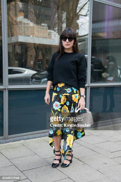 Fashion consultant Katherine Ormerod wears Celine sunglasses, Tabitha Simmons shoes, Sophie Hulme bag, Johnston's of Elgin top and a Top Shop skirt...