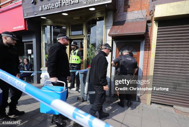 Police search team enters a flat above Shiraz Restaurant, in Hagley Road, Birmingham, which was raided by anti-terror police in connection with the...