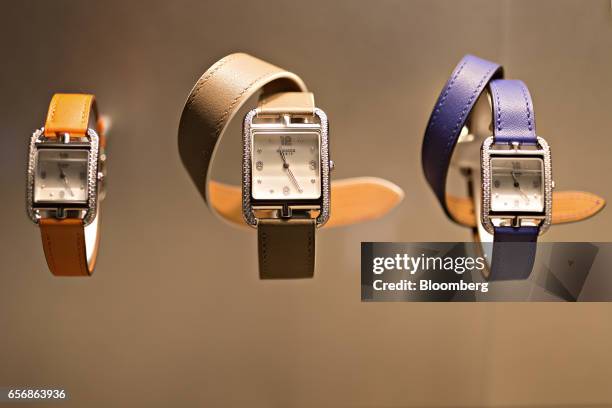 Cape Cod model luxury wristwatches, produced by Hermes International SCA, stand on display during the 2017 Baselworld luxury watch and jewelry fair...