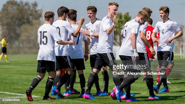 Elias Abouchabaka of Germany celebrates his goal with his teammates during the UEFA U17 elite round match between Germany and Armenia on March 23,...
