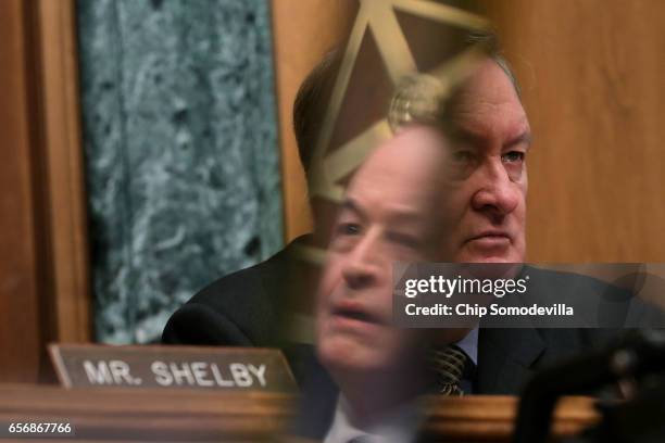 Senate Banking Committee member Sen. Richard Shelby is reflected in a computer screen as he and Chairman Mike Crapo hear testimony from Jay Claton...