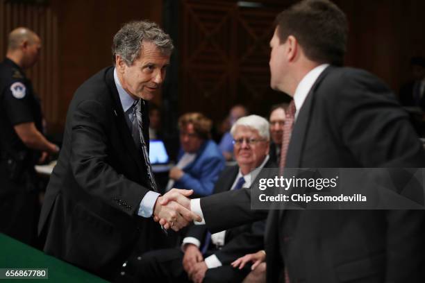 Senate Banking Committee ranking member Sen. Sherrod Brown welcomes Jay Claton before his confirmation hearing to be commissioner of the Securities...