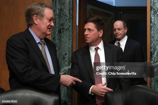 Senate Banking Committee Chairman Mike Crapo talks with Jay Claton before his confirmation hearing to be commissioner of the Securities and Exchange...