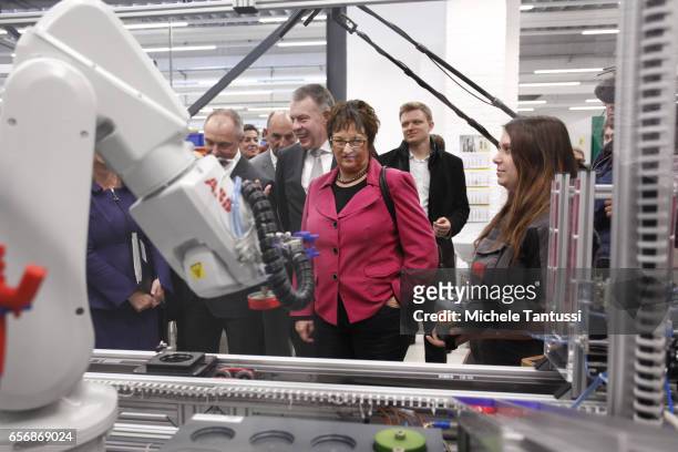 Germany Economy Ministry Brigitte Zypries observes young trainees as they operate mechanical Machine in the ABB training center on March 23, 2017 in...