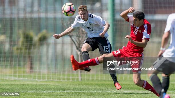 Suren Harutyunyan of Armenia challenges Kilian Ludewig of Germany during the UEFA U17 elite round match between Germany and Armenia on March 23, 2017...