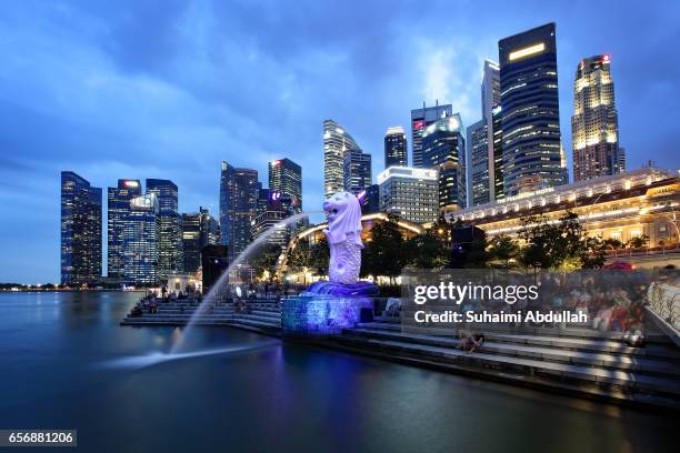 General view of the Central Business District and the Merlion, illuminated with a projection during the iLight Marina Bay on March 23, 2017 in...