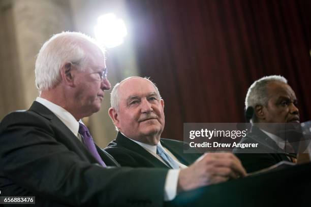 Former Senator Saxby Chambliss delivers opening remarks as Sonny Perdue, President TrumpÕs nominee to lead the Agriculture Department, and Rep. David...