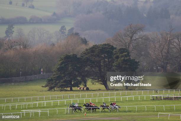 The runners and riders turn into the finishing straight during the Recticel Handicap Hurdle race at Chepstow Racecourse on March 23, 2017 in...