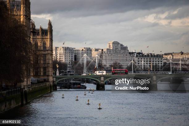 Police officer at the scene of a terrorist attack in which a number of pedestrians were mowed down on Westminster Bridge on March 22, 2017 in London,...