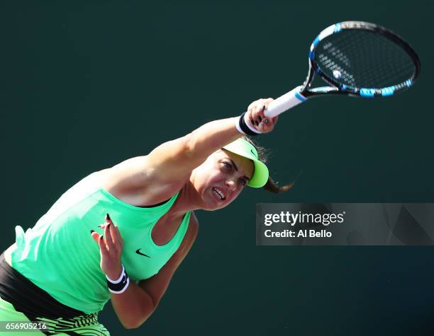 Ana Konjuh of Croatia serves against Kirsten Flipkens of Belgium during Day 4 of the Miami Open at Crandon Park Tennis Center on March 23, 2017 in...
