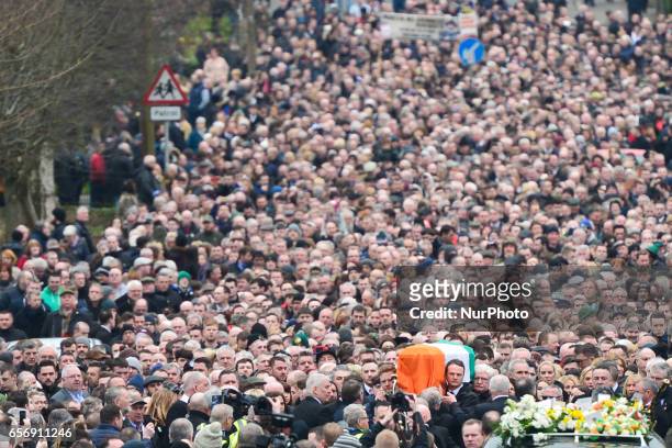 The coffin of former Northern Ireland Deputy First Minister Martin McGuinness in procession in the Bogside neighbourhood of Derry on its way to St....