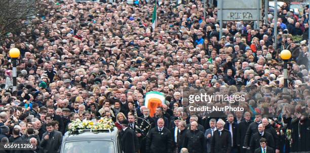 The coffin of former Northern Ireland Deputy First Minister Martin McGuinness in procession in the Bogside neighbourhood of Derry on its way to St....