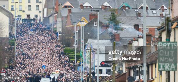 The coffin of former Northern Ireland Deputy First Minister Martin McGuinness in procession in the Bogside neighbourhood of Derry on its way to St....