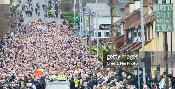 The coffin of former Northern Ireland Deputy First Minister Martin McGuinness in procession in the Bogside neighbourhood of Derry on its way to St....