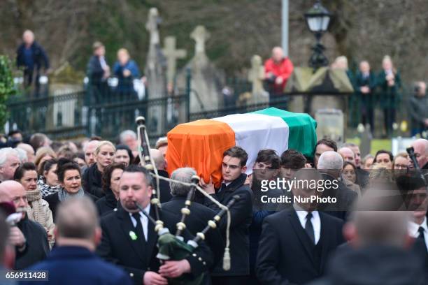The coffin of former Northern Ireland Deputy First Minister Martin McGuinness arrives to St. Columba's Church Longtower for Requiem Mass, after a...