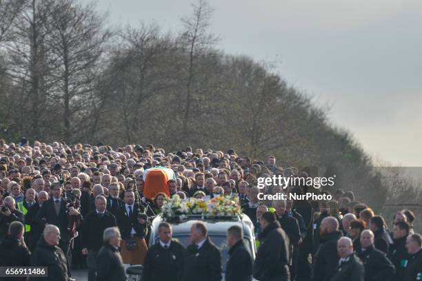 The coffin of former Northern Ireland Deputy First Minister Martin McGuinness in procession in the Bogside neighbourhood of Derry on its way from St....