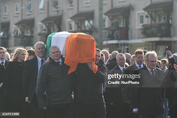 The coffin of former Northern Ireland Deputy First Minister Martin McGuinness in procession in the Bogside neighbourhood of Derry on its way from St....