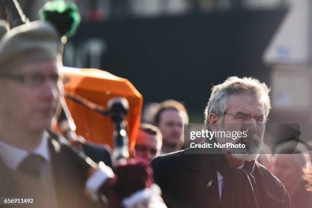 Thousands of mourners attend the funeral of Martin McGuinness in his Sinn Fein President Gerry Adams in front of Martin McGuinness coffin from St....