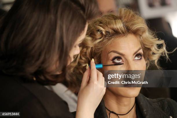 Cagla Sikel prepares backstage ahead of the Tuvanam show during Mercedes-Benz Istanbul Fashion Week March 2017 at Grand Pera on March 23, 2017 in...