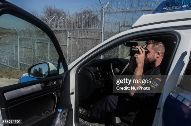 Member of the German federal police looking through his binocle while on patrol along the Bulgaria - Turkish border, near Kapitan Andreevo border...