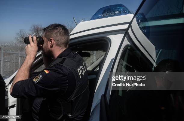 Member of the German federal police is looking through his binocle while on patrol along the Bulgaria - Turkish border, near Kapitan Andreevo border...