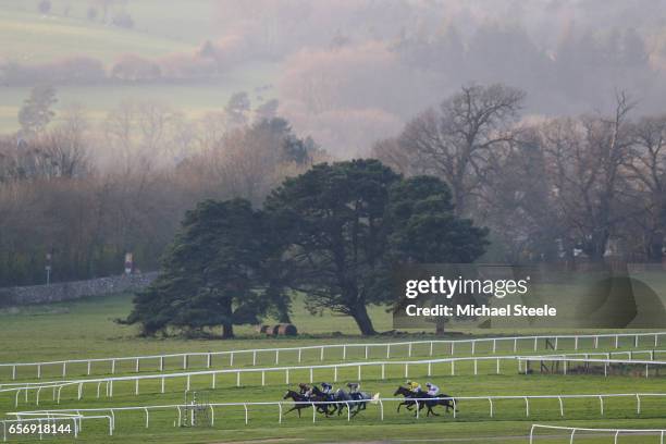 The field for the Competent Roofer Standard Open National Hunt Flat Race heads into the finishing straight at Chepstow Racecourse on March 23, 2017...
