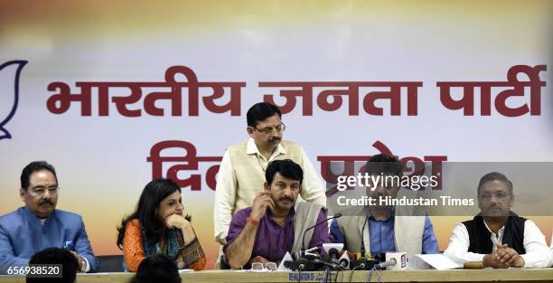 Delhi BJP President Manoj Tiwari and Vice President Shazia Ilmi, Rajeev Babbar and others address media persons over certain issue related to ruling...
