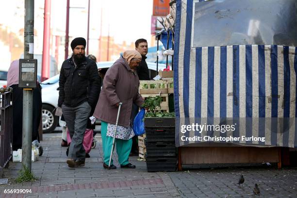 People go about their daily lives in Soho Road, Handsworth, famous for its multi-cultural residents on March 23, 2017 in Birmingham, England. After...