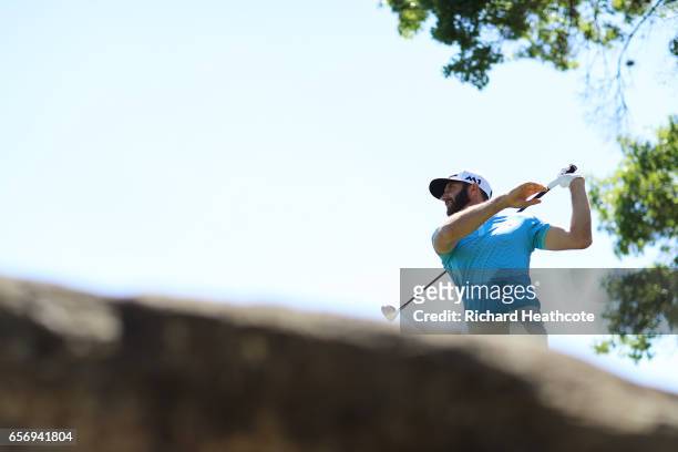 Dustin Johnson tees off on the 5th hole of his match during round two of the World Golf Championships-Dell Technologies Match Play at the Austin...