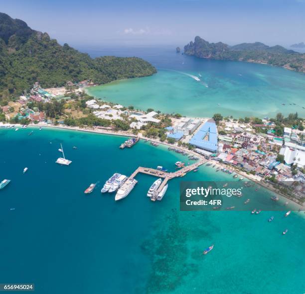 main pier ao tonsai with long-tail boats, bird's-eye view, phi phi islands, thailand - phi phi islands stock pictures, royalty-free photos & images