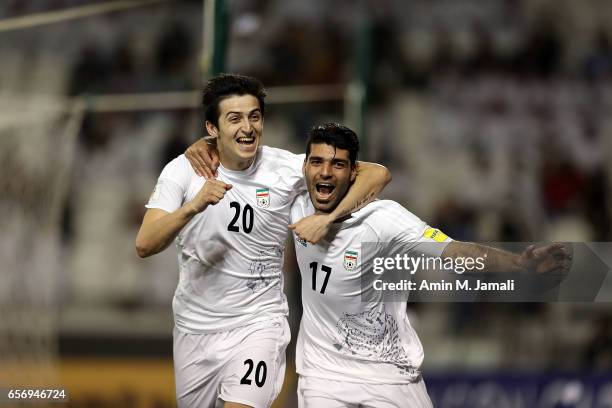 Sardar Azmoun and Mehdi Taremi of Iran celebrate after first goal during Qatar against Iran - FIFA 2018 World Cup Qualifier on March 23, 2017 in...