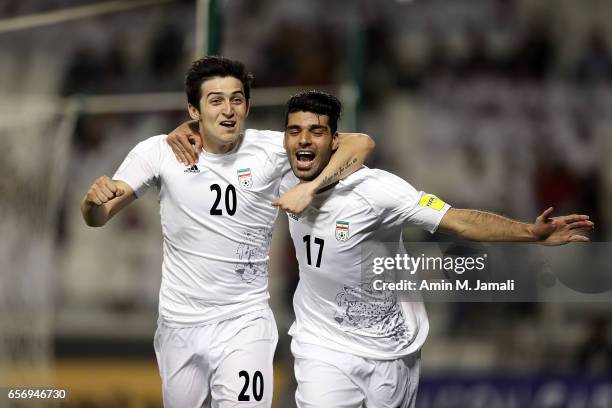 Sardar Azmoun and Mehdi Taremi of Iran celebrate after first goal during Qatar against Iran - FIFA 2018 World Cup Qualifier on March 23, 2017 in...