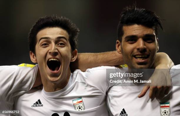 Sardar Azmoun and Mehdi Taremi of Iran celebrate after first goal during Qatar against Iran - FIFA 2018 World Cup Qualifier on March 23, 2017 in...