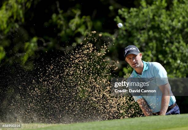Russell Knox of Scotland plays his third shot on the par 4, first hole in his match against K T Kim during the second round of the 2017 Dell Match...