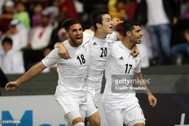 Mehdi Taremi , Sardar Azmoun and Alireza Jahan Bakhsh of Iran celebrate after scoring a goal during the 2018 FIFA World Cup Asian Qualifying group A...