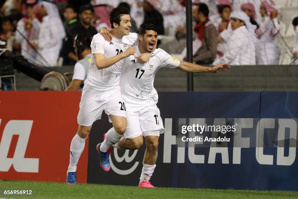 Mehdi Taremi and Sardar Azmoun of Iran celebrate after scoring a goal during the 2018 FIFA World Cup Asian Qualifying group A football match between...