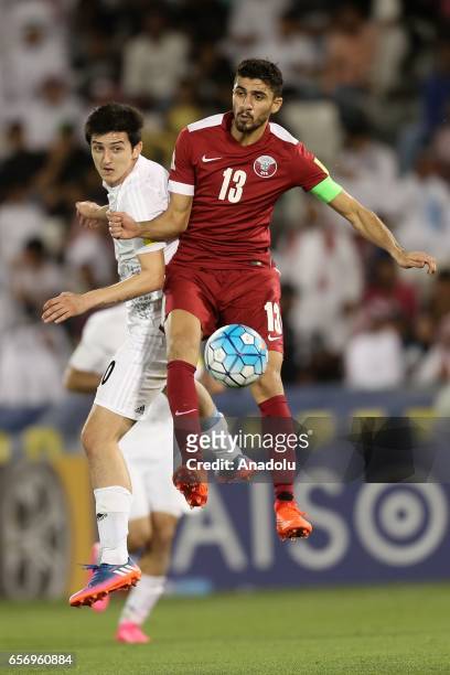 Ibrahim Majed of Qatar in action against Sardar Azmoun of Iran during the 2018 FIFA World Cup Asian Qualifying group A football match between Qatar...