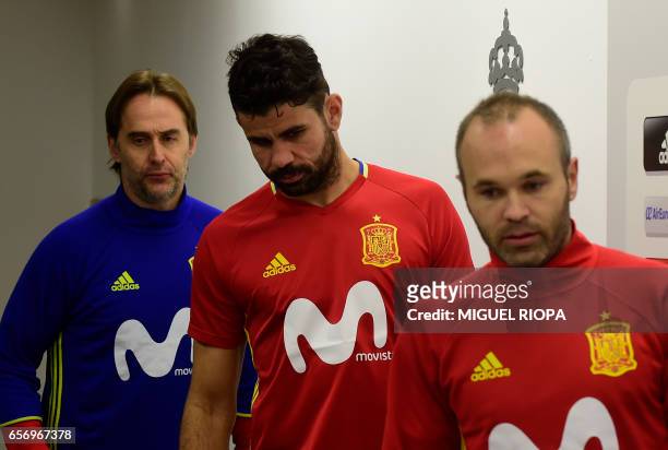 Spain's coach Julen Lopetegui , forward Diego Costa and midfielder Andres Iniesta arrive for a press conference at the Molinon stadium in Gijon, on...