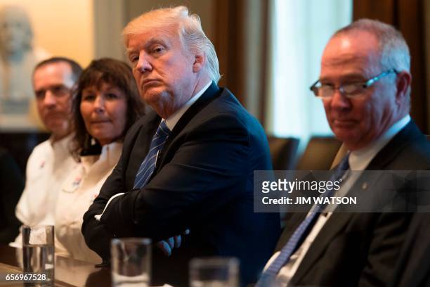 President Donald Trump welcomes truckers and CEOs to the White House in Washington, DC, March 23 to discuss healthcare. / AFP PHOTO / JIM WATSON