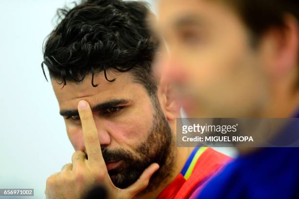 Spain's forward Diego Costa gestures during a press conference at the Molinon stadium in Gijon, on March 23, 2017 on the eve of the World Cup 2018...