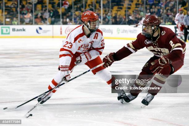 Boston College Eagles defenseman Scott Savage pressures Boston University Terriers forward Jakob Forsbacka Karlsson during a Hockey East semifinal...