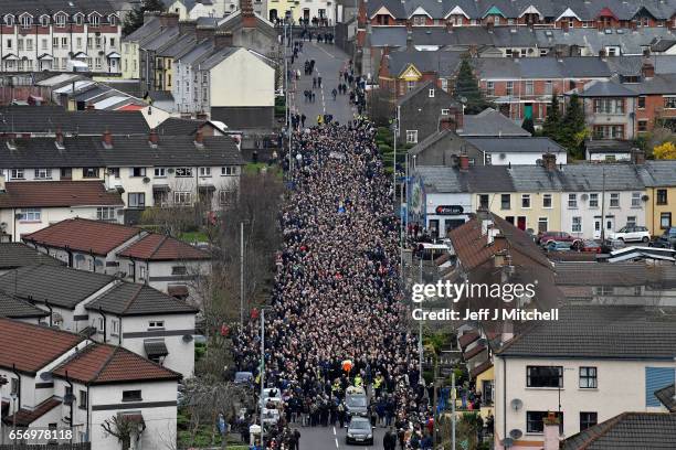 The funeral cortege passes through the streets of Derry on March 23, 2017 in Londonderry, Northern Ireland. The funeral is held for Northern...