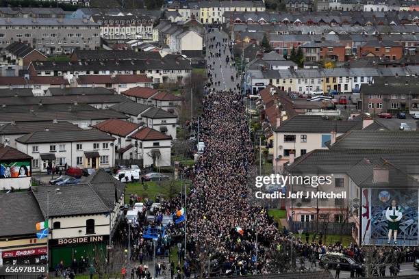 The funeral cortege passes through the streets of Derry on March 23, 2017 in Londonderry, Northern Ireland. The funeral is held for Northern...