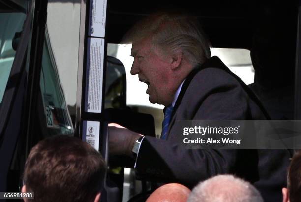 President Donald Trump sits in the cab of a truck as he welcomes members of American Trucking Associations to the White House March 23, 2017 in...