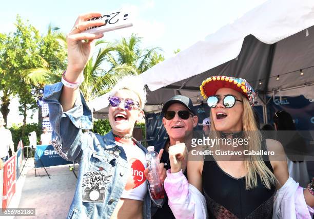 Miriam Nervo and Olivia Nervo take a selfie with president & chief content officer, SiriusXM, Scott Greenstein at the SiriusXM Music Lounge at 1...
