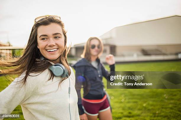 young women athletes leaving playing field - 14 year old brunette girl stock pictures, royalty-free photos & images