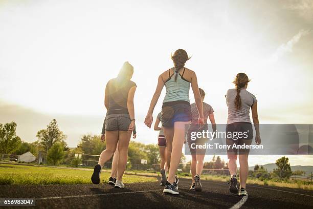 young women athletes after workout - alleen tienermeisjes stockfoto's en -beelden