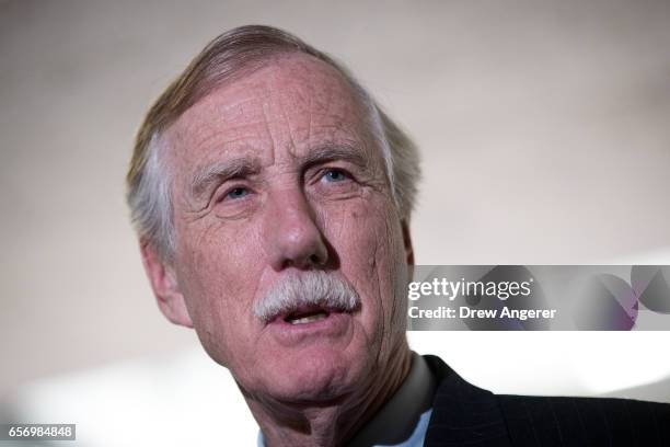 Sen. Angus King answers questions from reporters following a closed briefing with the Senate Select Committee on Intelligence concerning Russian...