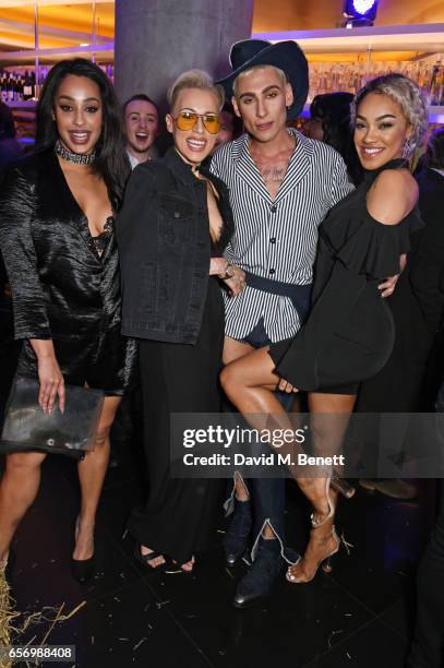 Kyle De'Volle poses with Alexandra Buggs, Courtney Rumbold and Karis Anderson of Stooshe at the launch of the JF London x Kyle De'Volle fall/winter...